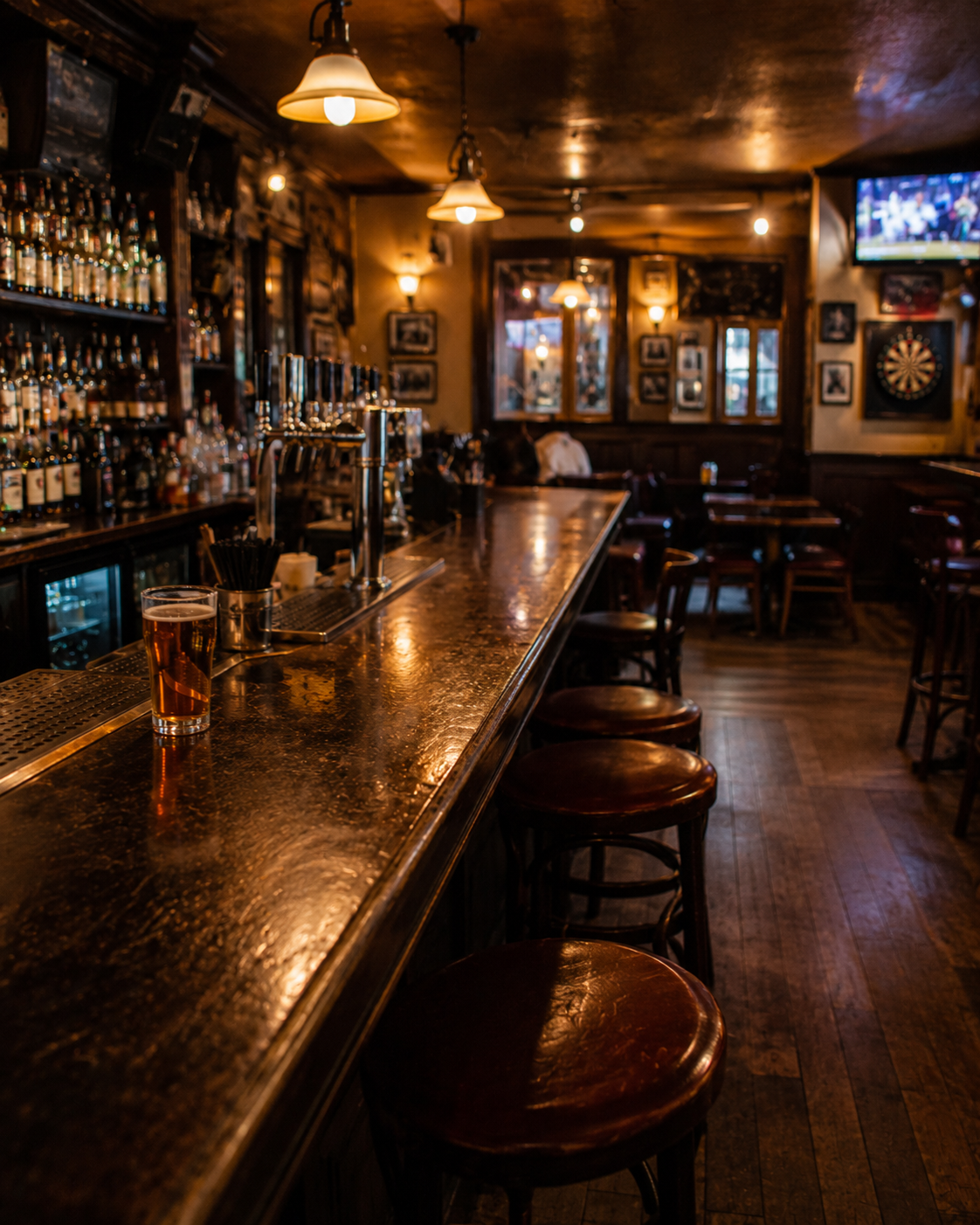 Warm wooden neighborhood tavern interior with booths and bar seating