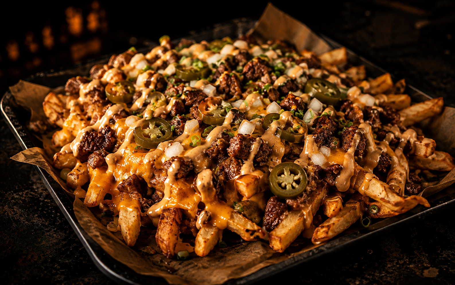 Loaded seasoned fries with cheese and toppings